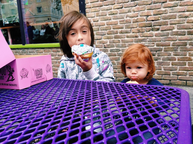 Lucy and Penn eating at Voodoo Doughnuts